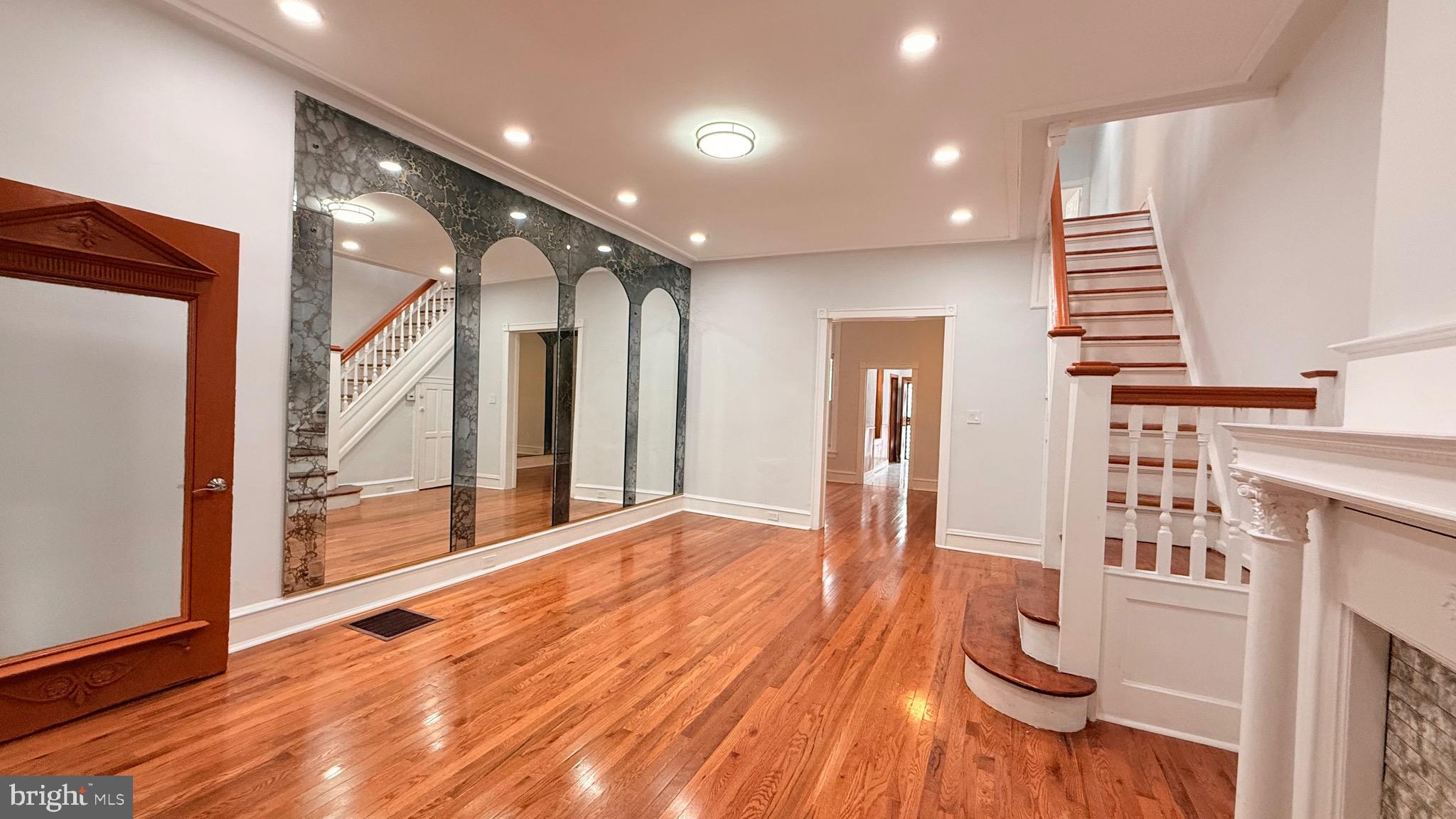 a view of entryway with wooden floor