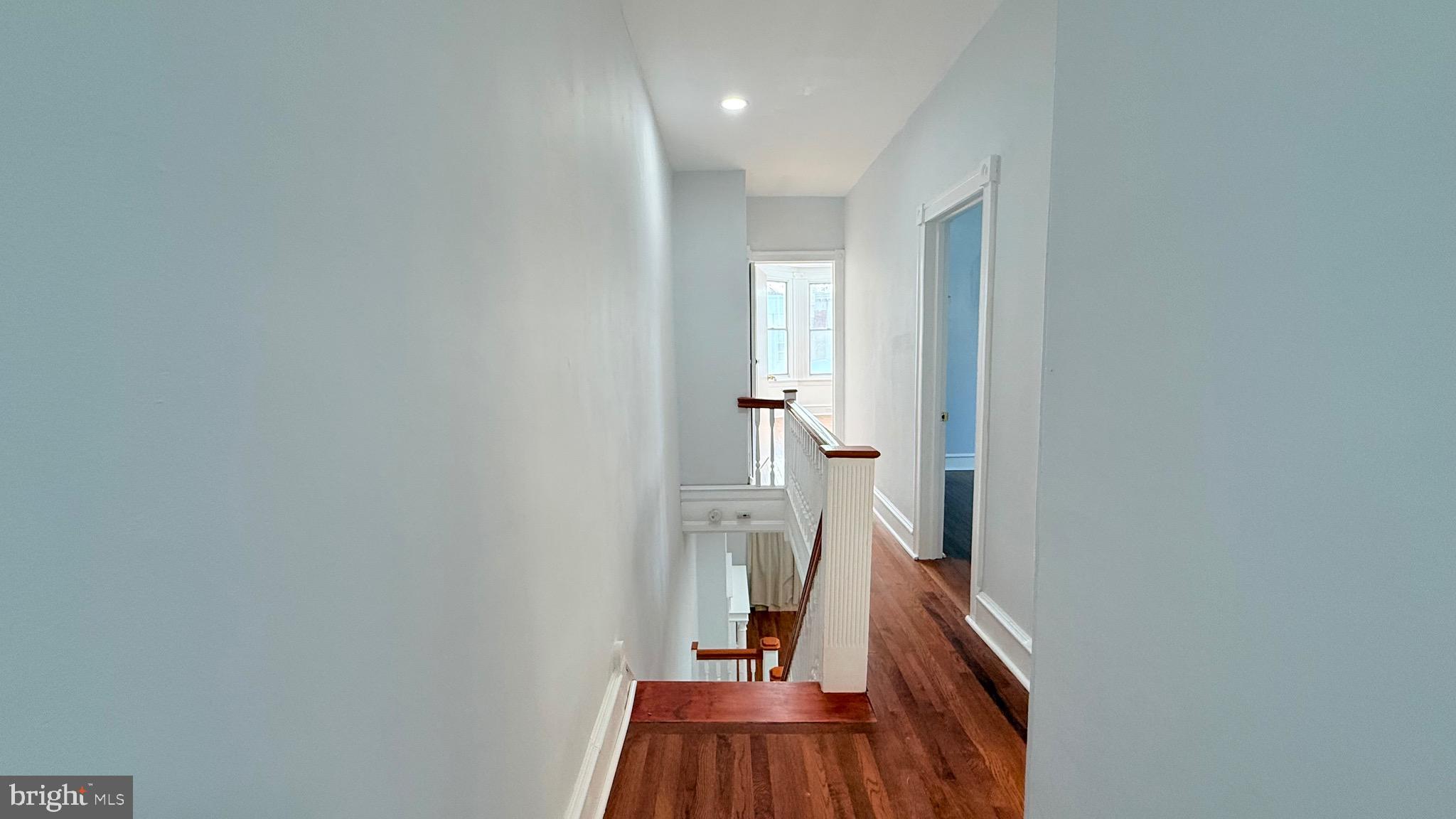 1333 Colwyn Street Philadelphia, PA 19140 - Photo 12 of 38 a view of a hallway with wooden floor and a bathroom