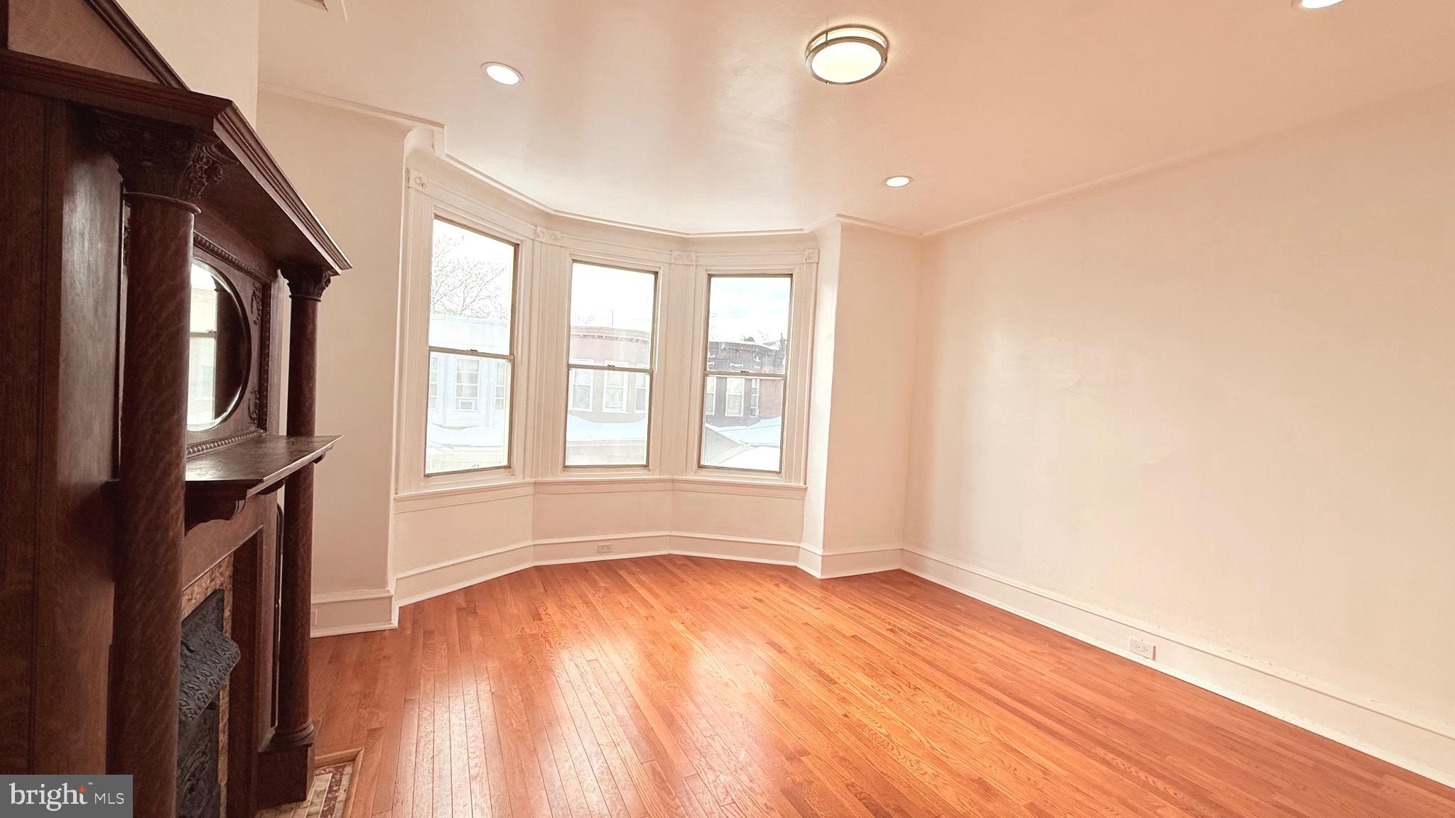 1333 Colwyn Street Philadelphia, PA 19140 - Photo 14 of 38 a view of empty room with wooden floor and fan