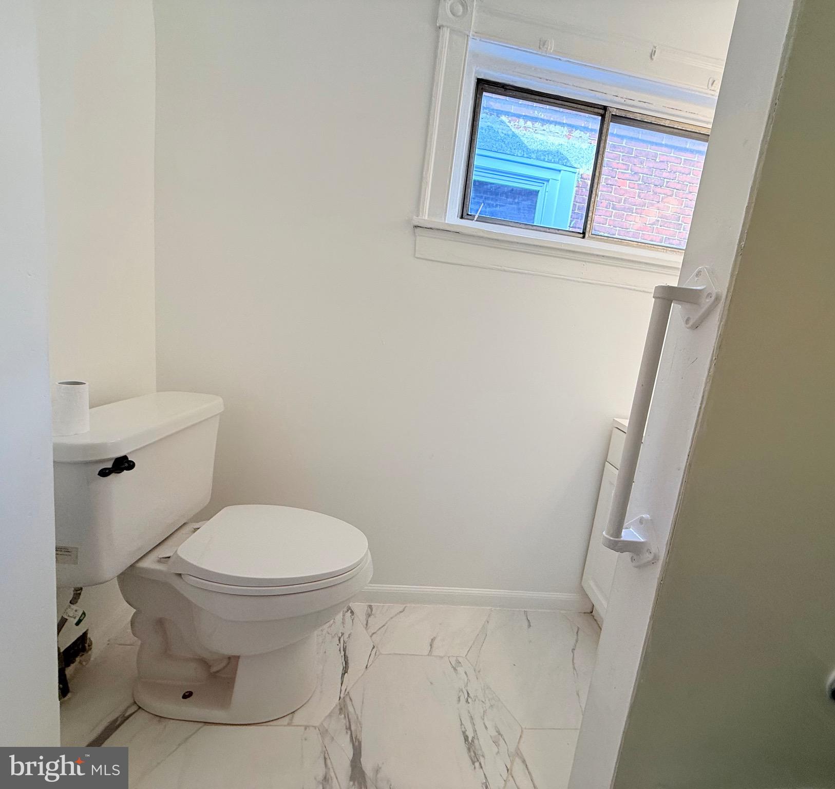 1333 Colwyn Street Philadelphia, PA 19140 - Photo 20 of 38 a bathroom with a toilet and a sink