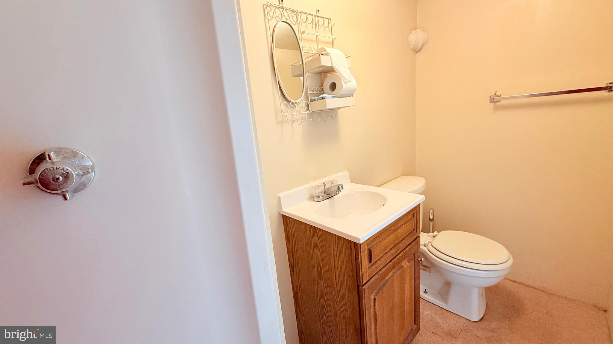1333 Colwyn Street Philadelphia, PA 19140 - Photo 29 of 38 a bathroom with a sink a toilet and mirror