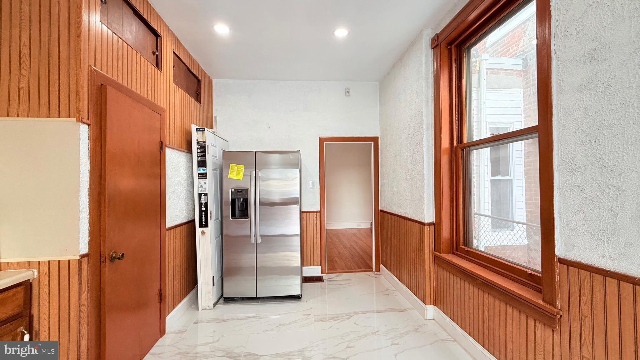 1333 Colwyn Street Philadelphia, PA 19140 - Photo 10 of 38 a view of a hallway with furniture and windows