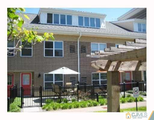 358 Rector Street, Unit 501 Perth Amboy, NJ 08861 - Photo 1 of 25 a front view of a building with balcony