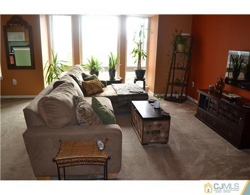 358 Rector Street, Unit 501 Perth Amboy, NJ 08861 - Photo 12 of 25 a living room with furniture and large windows