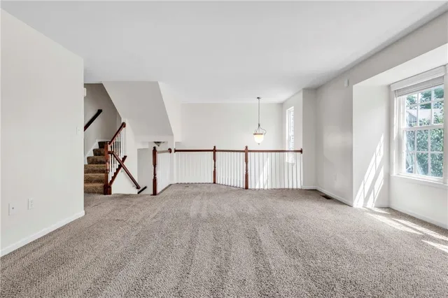 a view of an empty room with windows