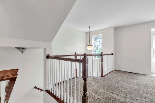 a view of a hallway with a window