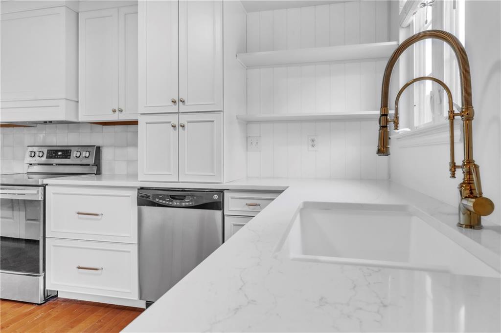 305 Broadstone Drive Mars, PA 16046 - Photo 2 of 31 a kitchen with white cabinets and appliances