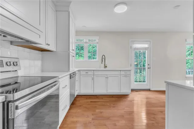 a kitchen with a sink and cabinets