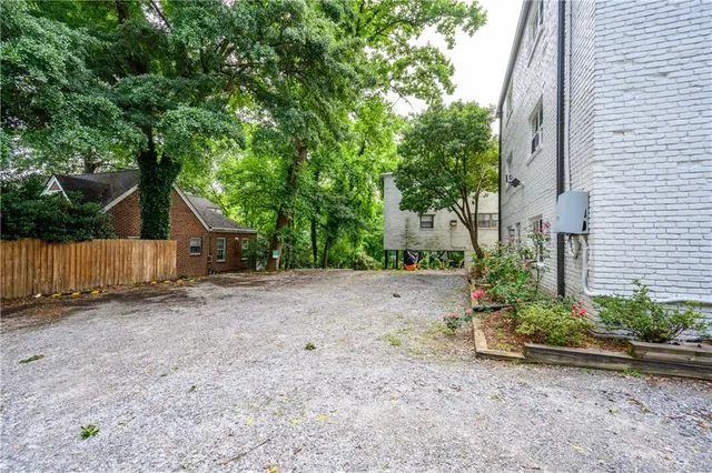 a view of a house with a tree in the background
