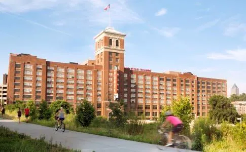 a front view of a building with a lot of windows