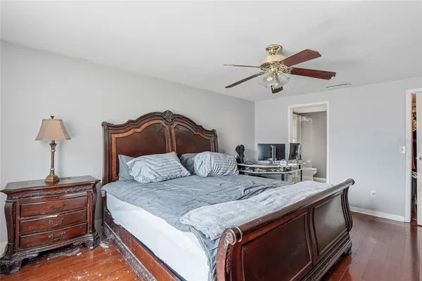 a bathroom with a shower a sink and a mirror