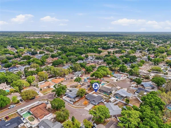 an aerial view of residential houses with outdoor space