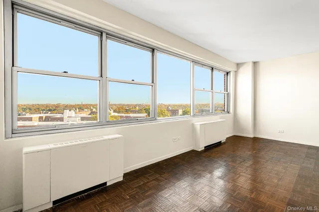 a view of a room with wooden floor