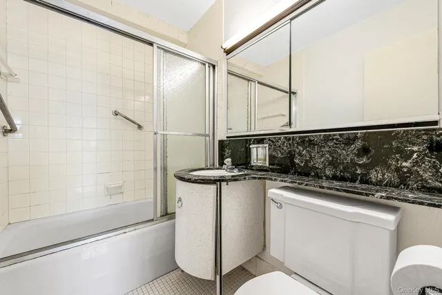 a view of washer and dryer with kitchen in the background