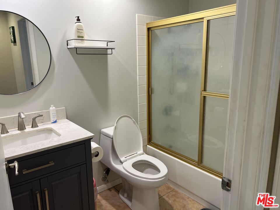 19528 Eagle Ridge Lane Porter Ranch, CA 91326 - Photo 9 of 20 a bathroom with a sink a toilet and shower