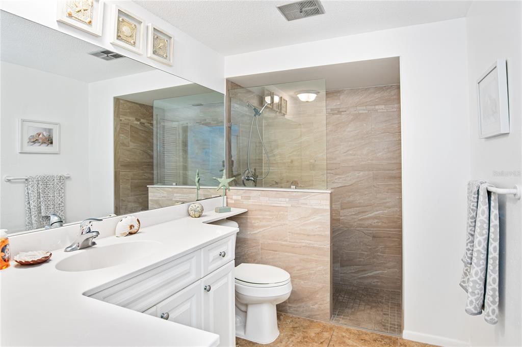 217 Casey Key Road Nokomis, FL 34275 - Photo 13 of 51 a bathroom with a sink toilet and shower