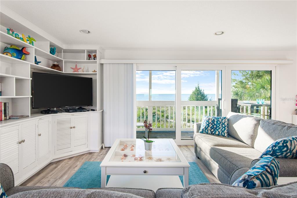 217 Casey Key Road Nokomis, FL 34275 - Photo 18 of 51 a living room with furniture and a flat screen tv