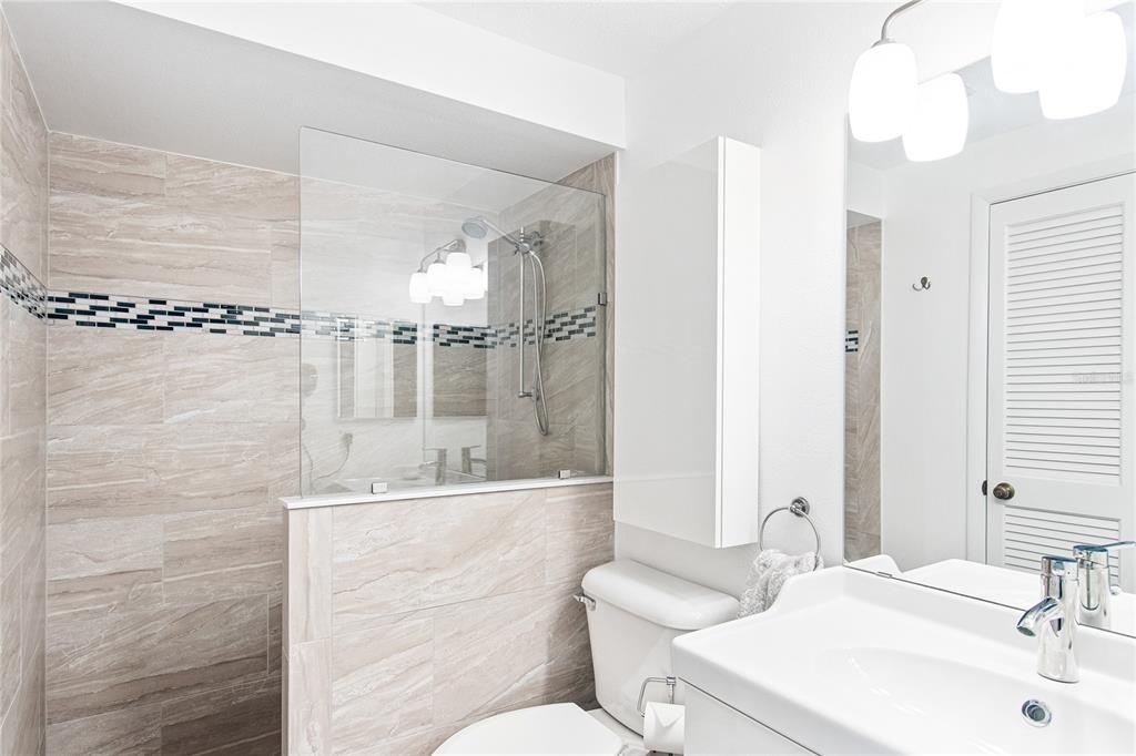 217 Casey Key Road Nokomis, FL 34275 - Photo 21 of 51 a bathroom with a sink toilet and shower