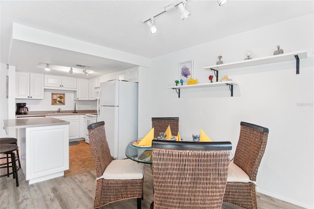 217 Casey Key Road Nokomis, FL 34275 - Photo 23 of 51 a living room with furniture and kitchen view