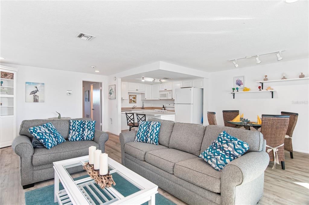 217 Casey Key Road Nokomis, FL 34275 - Photo 25 of 51 a living room with furniture and a chandelier