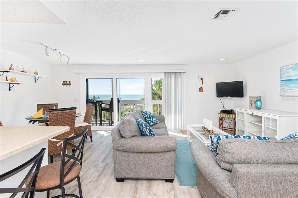 217 Casey Key Road Nokomis, FL 34275 - Photo 27 of 51 a living room with furniture and a flat screen tv