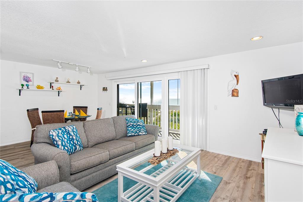 217 Casey Key Road Nokomis, FL 34275 - Photo 28 of 51 a living room with furniture and a flat screen tv