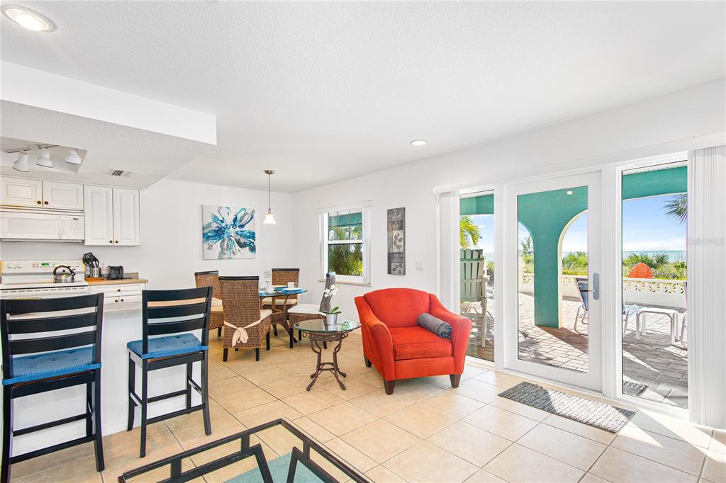 217 Casey Key Road Nokomis, FL 34275 - Photo 35 of 51 a living room filled with furniture and large windows