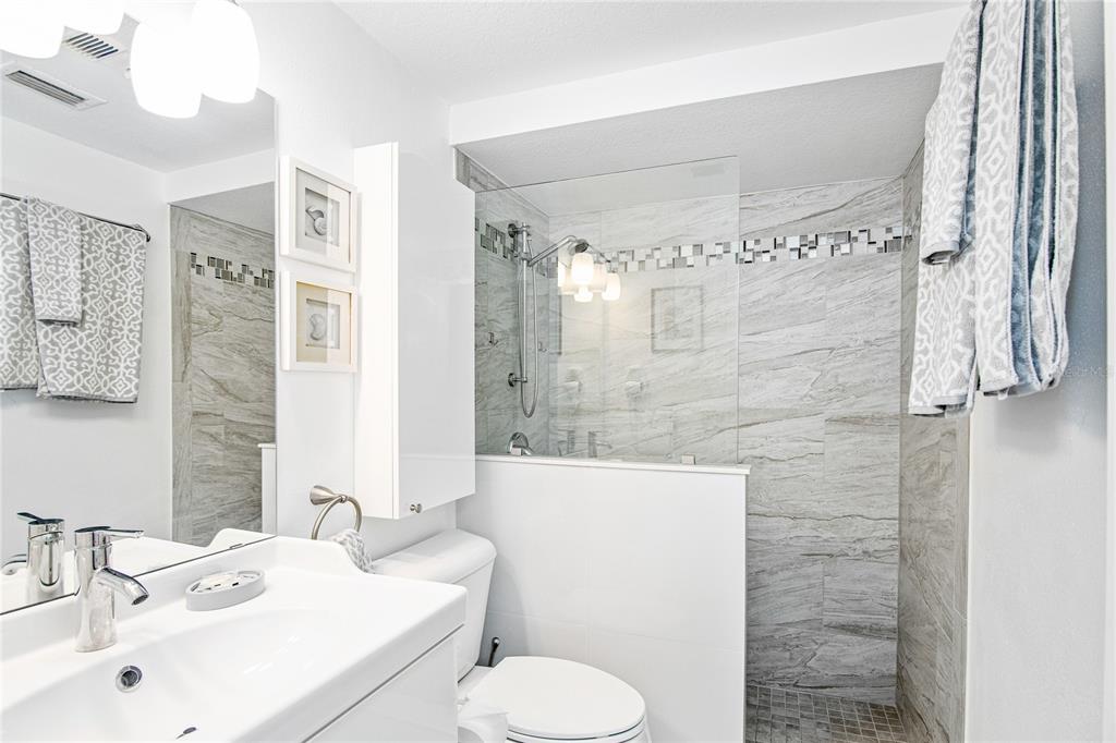 217 Casey Key Road Nokomis, FL 34275 - Photo 36 of 51 a bathroom with a sink toilet and shower