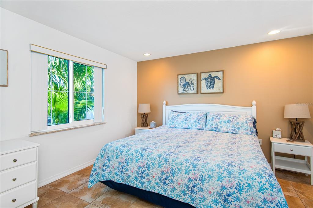 217 Casey Key Road Nokomis, FL 34275 - Photo 37 of 51 a bedroom with a bed and a window