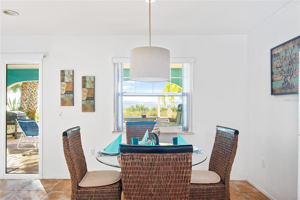 217 Casey Key Road Nokomis, FL 34275 - Photo 38 of 51 a dining room with furniture and window