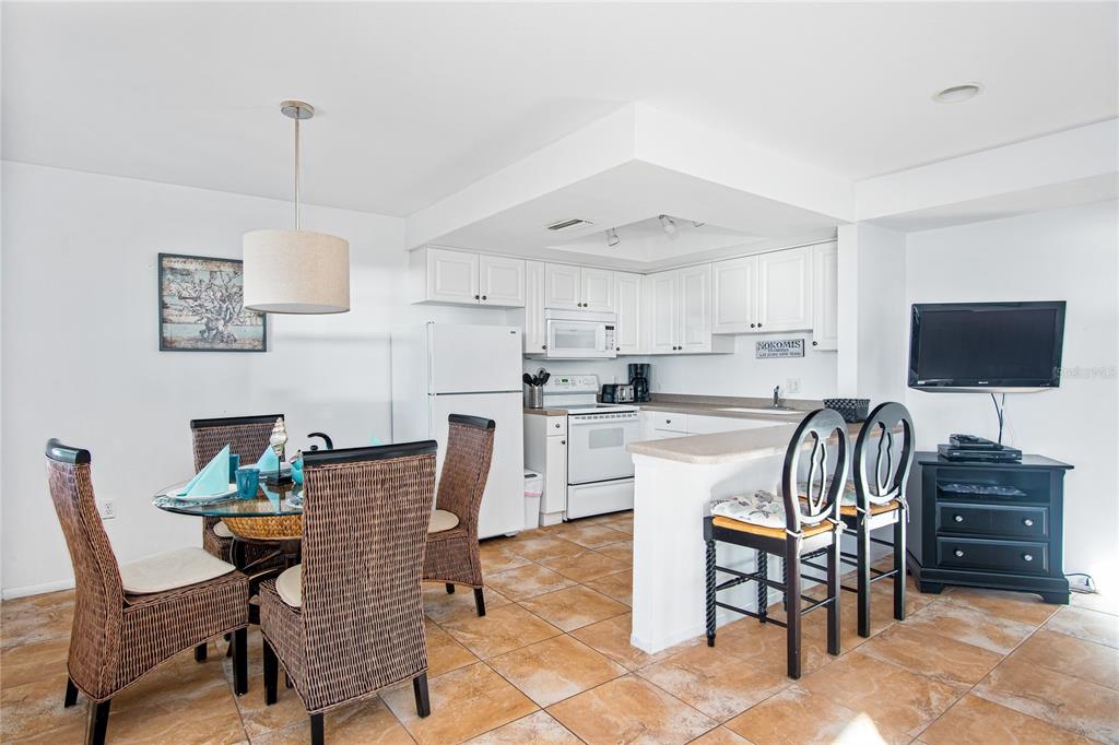217 Casey Key Road Nokomis, FL 34275 - Photo 39 of 51 a dining room with furniture and window