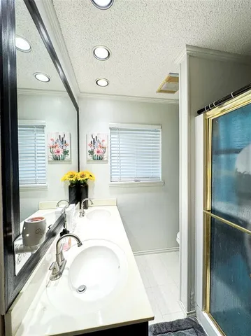 a bathroom with a sink and mirror