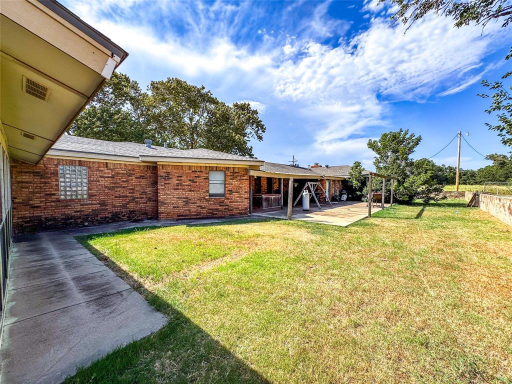 1303 Grand Central Avenue O'Brien, TX 79539 - Photo 31 of 40 a view of a house with swimming pool
