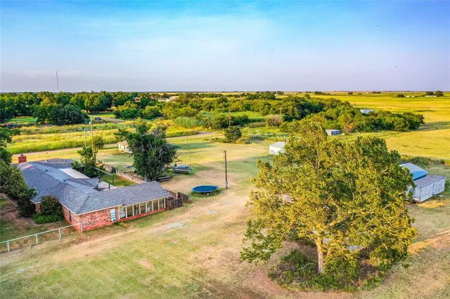 an aerial view of a house with swimming pool