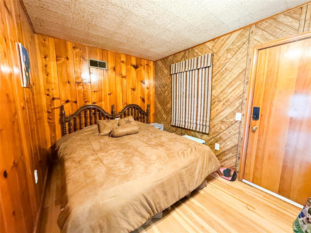 1303 Grand Central Avenue O'Brien, TX 79539 - Photo 7 of 40 a bedroom with a bed and a window