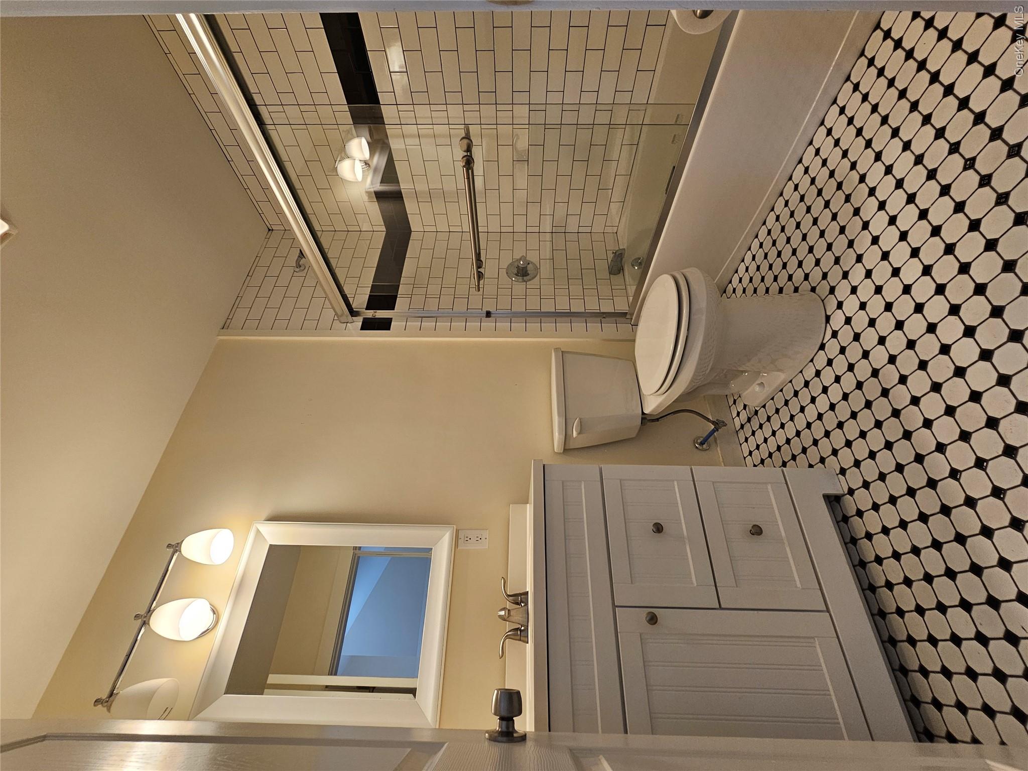 231 Reynolds Road, Unit 11 Loch Sheldrake, NY 12759 - Photo 5 of 20 Full bathroom with vanity, combined bath / shower with glass door, and toilet