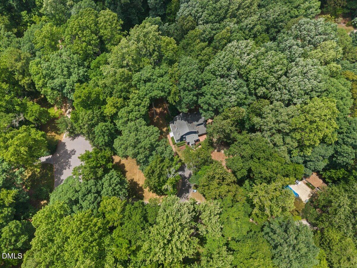6516 Bakersfield Drive Raleigh, NC 27606 - Photo 56 of 59 an aerial view of residential house with outdoor space and trees all around