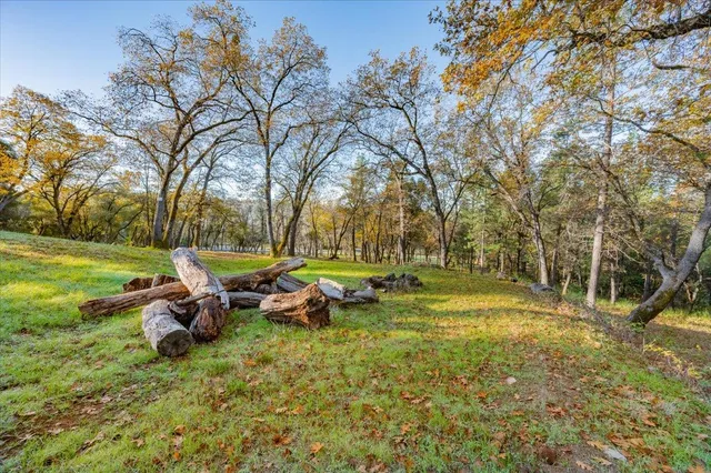 a backyard of a house with table and chairs