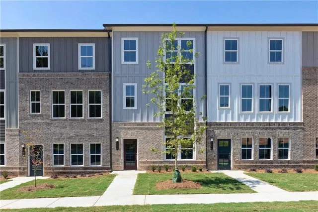 a view of a brick building with many windows