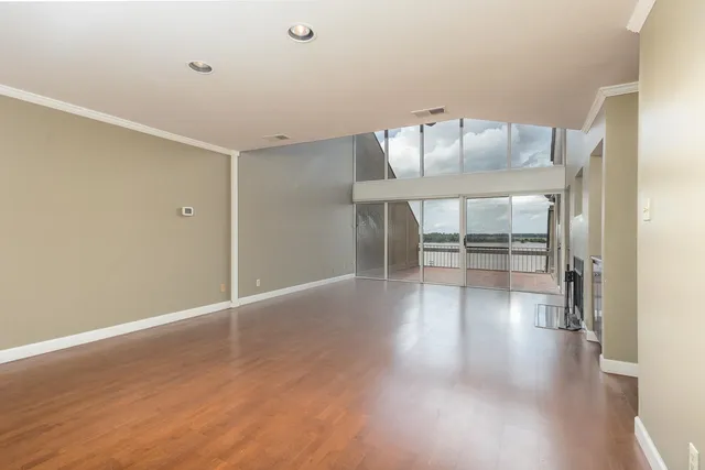 a view of a big room with windows