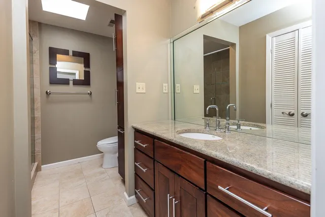 a kitchen with stainless steel appliances granite countertop cabinets and wooden floor