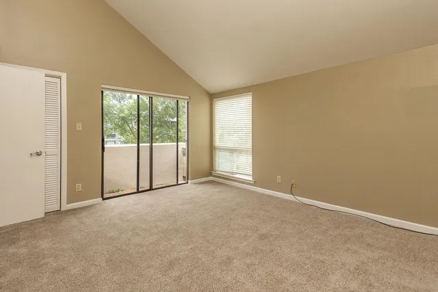 a view of a lake with a building in the background