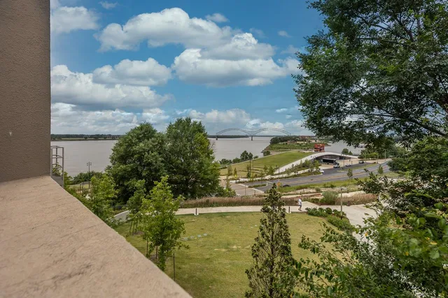 a balcony with furniture and wooden floor