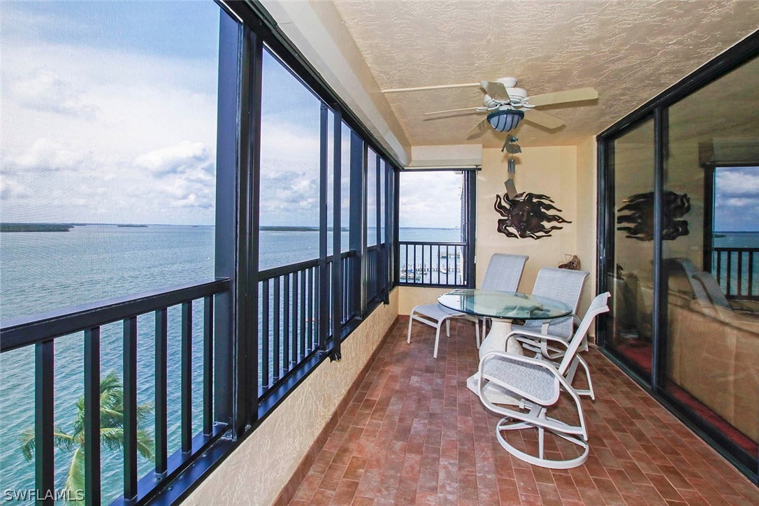 15021 Punta Rassa Road, Unit 602 Fort Myers, FL 33908 - Photo 23 of 35 a view of a chairs and table in patio of the house
