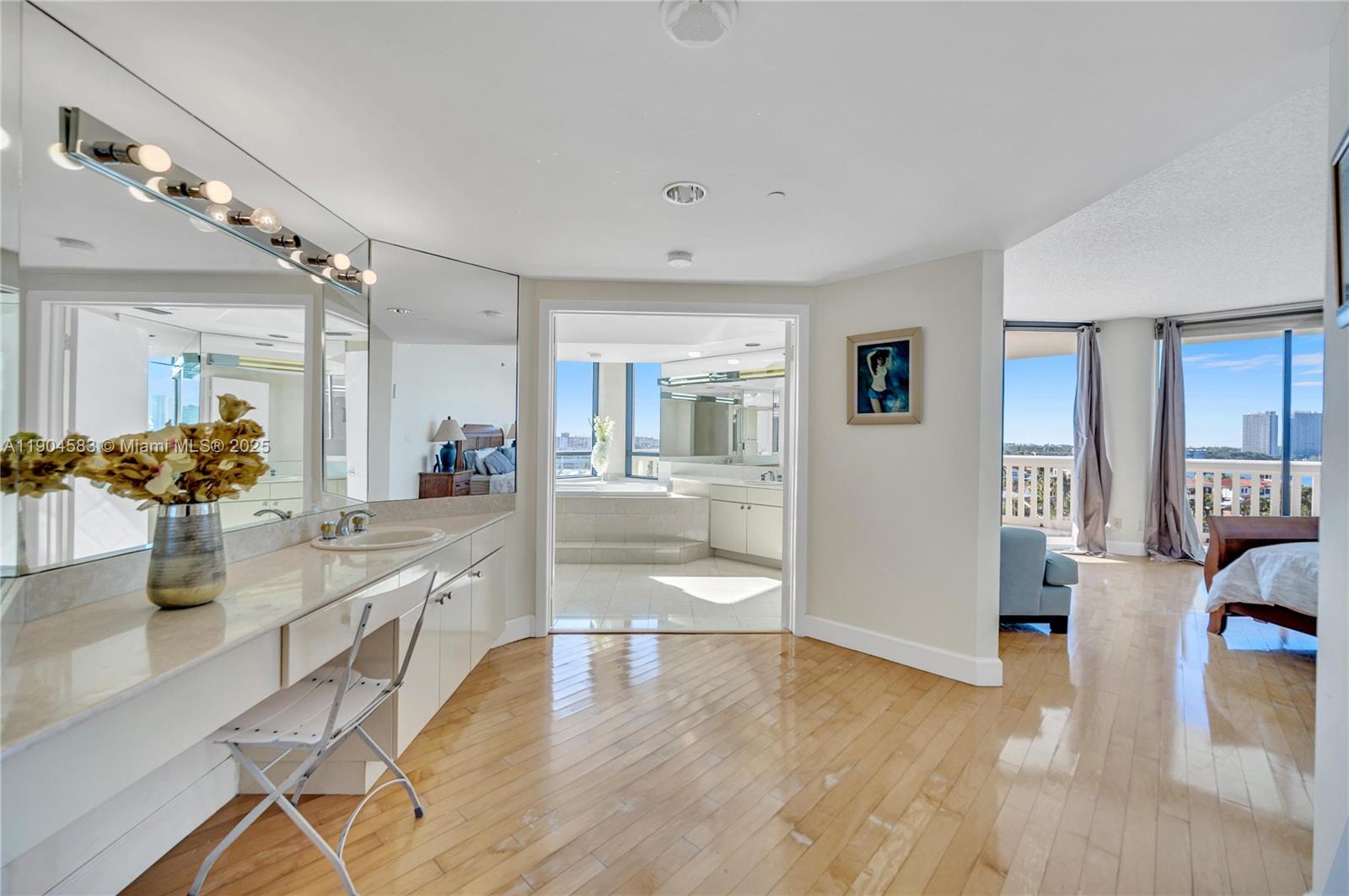 2000 Island Boulevard, Unit 806 Aventura, FL 33160 - Photo 15 of 30 a view of a living room kitchen and a wooden floor