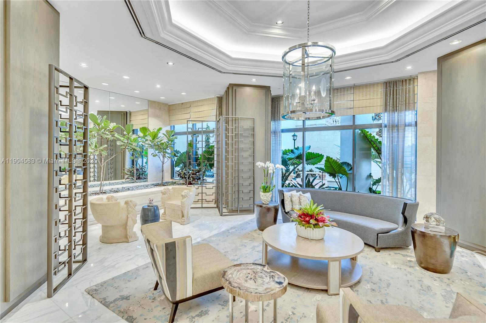 2000 Island Boulevard, Unit 806 Aventura, FL 33160 - Photo 28 of 30 a dining room with furniture a chandelier and wooden floor
