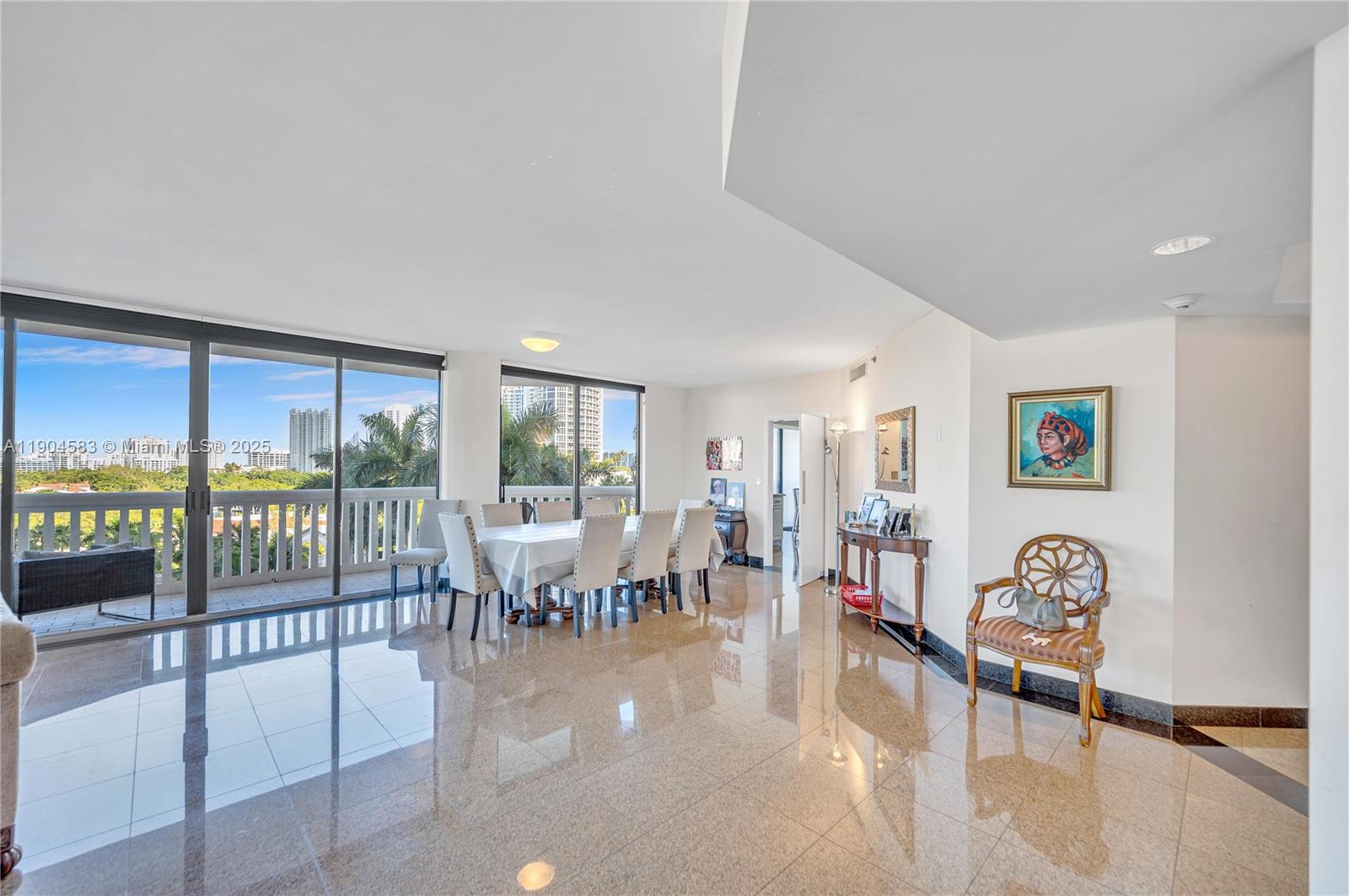 2000 Island Boulevard, Unit 806 Aventura, FL 33160 - Photo 3 of 30 a living room with lots of furniture and a large window