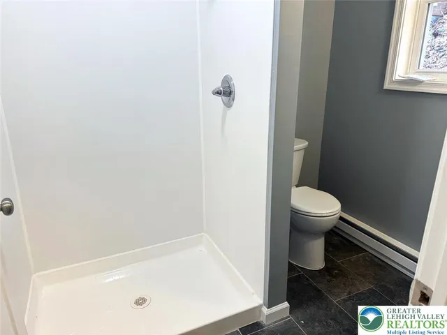 a view of empty room with a ceiling fan