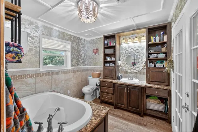 a bathroom with a tub and a sink