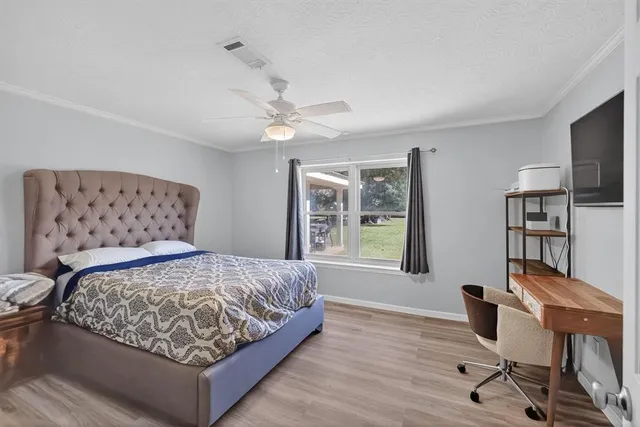 a bedroom with a bed and window